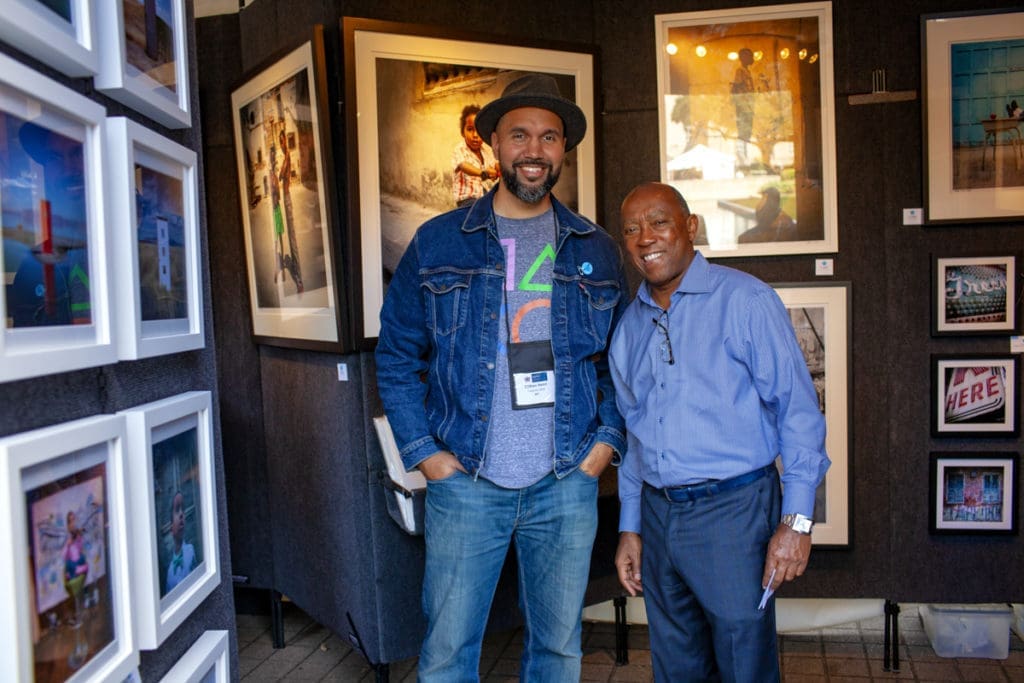 Mayor Sylvester Turner, pictured here with a Bayou City Art Festival contributor from previous years, joins in support of the 'Save Our Art — One Passion. One Purpose.' campaign. (Photo by Katya Horner)