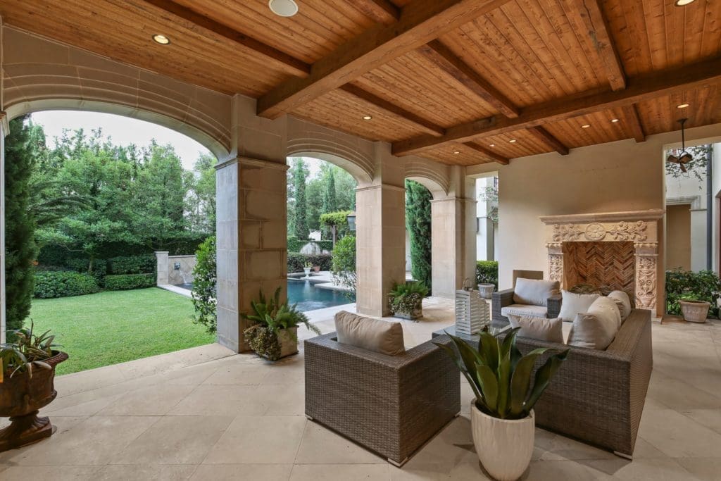 Relax in the outdoor room with focal point fireplace.