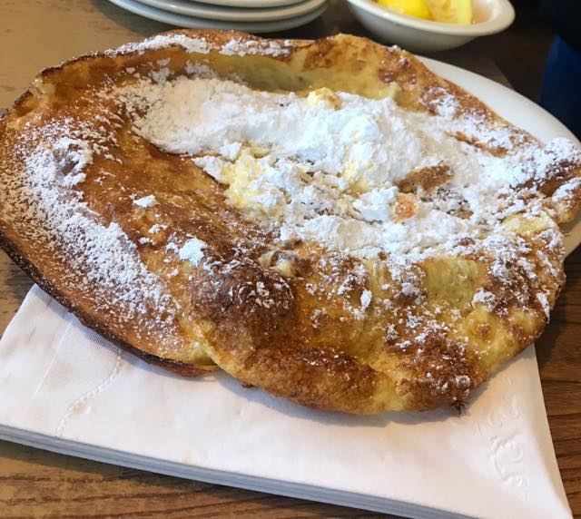 The famous German  pancake gets slathered with butter, lemon and powdered sugar.