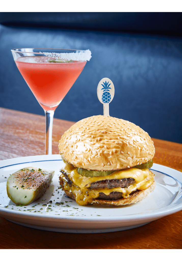 The Cheeseburger paired with a martini, perhaps the best way to end your afternoon. (Photo by Courtesy of Vandelay Hospitality Group)