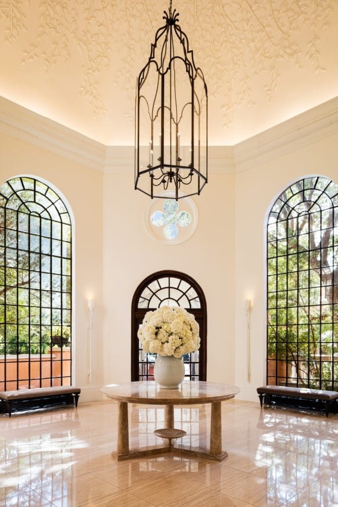 The Mansion's hand-carved plaster rotunda created by Casci Ornamental Plaster. Thomas Pheasant designed the light fixture and marble table. 