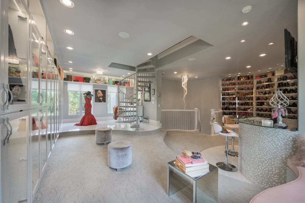 A $10,000 designer gown gracing  a mannequin is a focal point of one of the three floors of the closet.