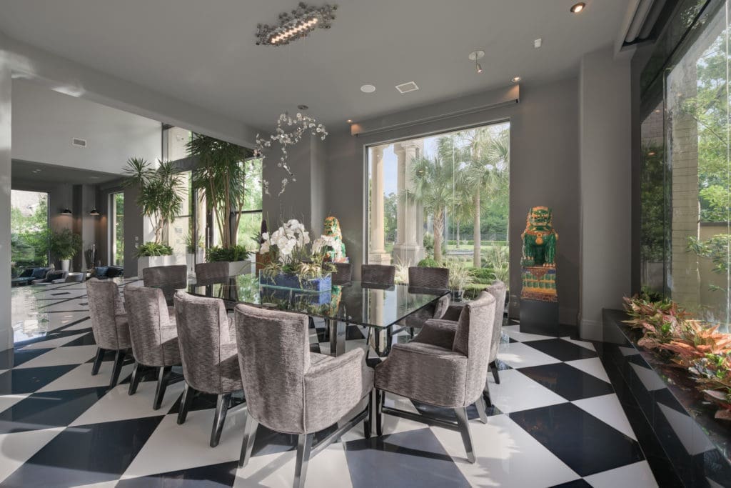 The formal dining room is one of many entertaining areas for the house with two kitchens.