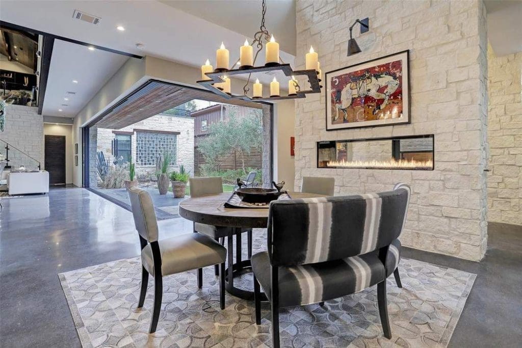 Glass doors open wide to deliver outdoor/indoor living. 
