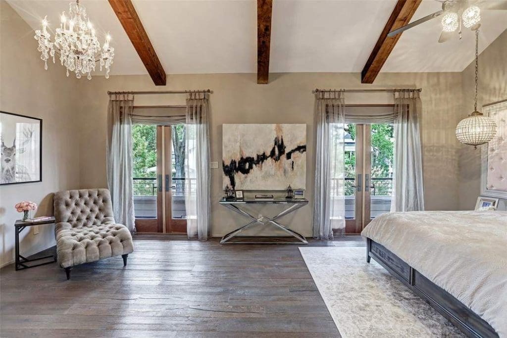 The second-floor master suite opens through French doors to a balcony that runs 37.5 feet in length.