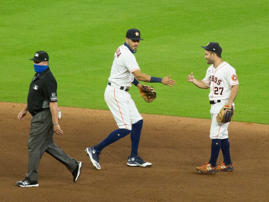 Carlos Correa and Jose Altuve know how to win baseball games. (Photo by F. Carter Smith)