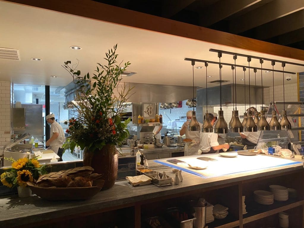 A view to the open kitchen from where Chef Aaron Bludhorn delivers his exceptional cuisine. (Photo by Shelby Hodge)
