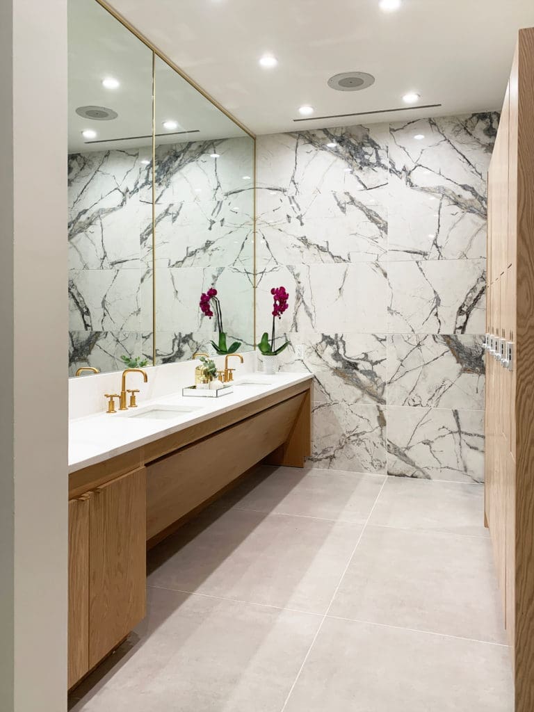 An expanded, marble-filled women's lounge. 