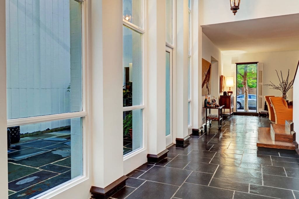 Slate floors and soaring ceilings are distinctive features in the townhouse. (Photo by TK Images)