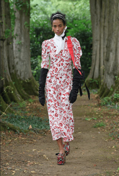 Erdem floral dress, accesorized with black gloves and wedge heels. (Photo courtesy of Erdem)