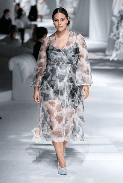 Ashley Graham walks the runway at the Fendi runway show in a sheer wrap dress. (Photo courtesy of Fendi)