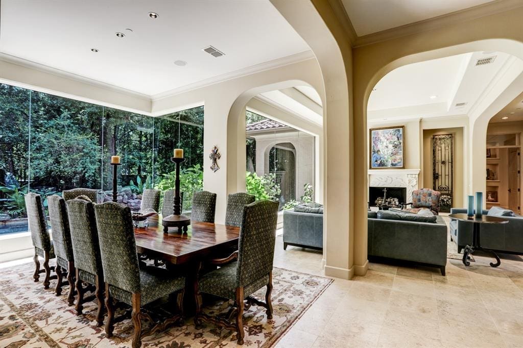 Living and dining are open with frameless windows.