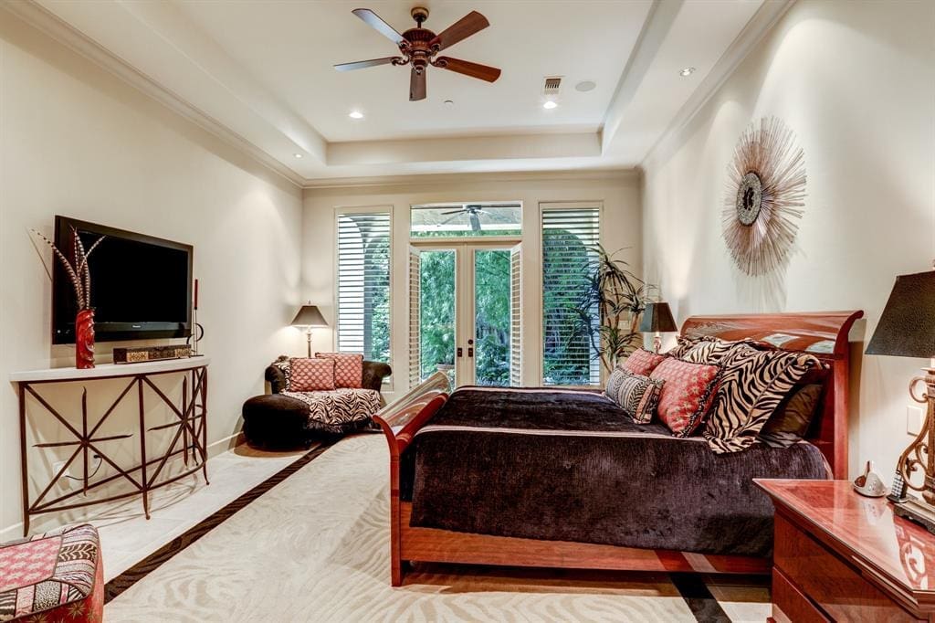 The home's master opens to pool and ravine beyond.