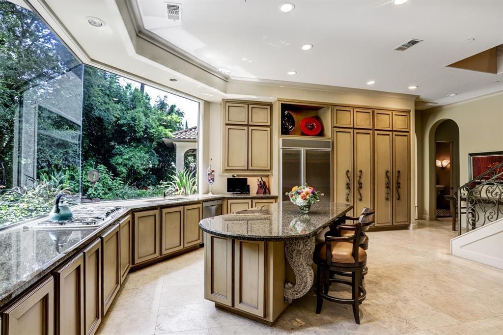 The Spacious kitchen with functional island/bar.