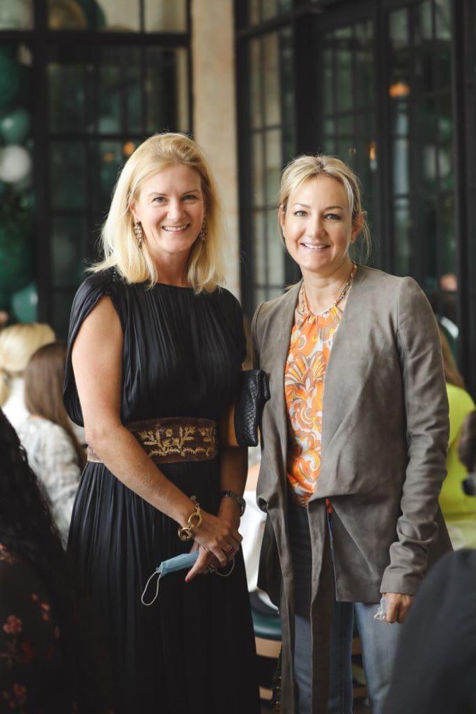 Allison Crosswell and Callie Simmons, masks in hand, unmask for a photo at The Annie Cafe & Bar Sunday brunch. (Photo by Johnny Than)