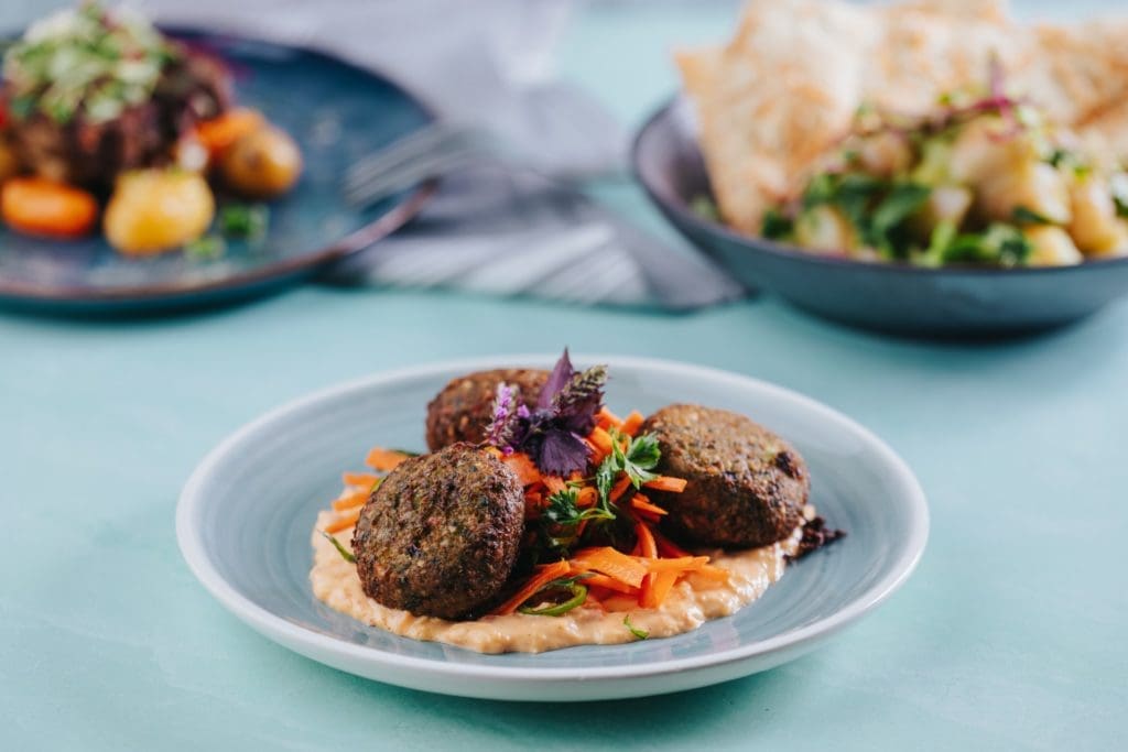 Encina boasts a New American menu with Southern Flair including Black Eyed Fritters. (Photo by Kathy Tran)