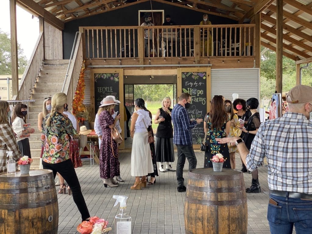 The ladies and a sprinkling of gents gather at Hope Farm's Fashion in the Fields outing benefiting Recipe for Success. (Photo by Shelby Hodge)