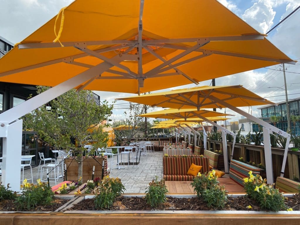 The Sporting Club is focusing on filling its vast patio for Funday Sundays and Saturdays with brunch offering rosé and champagne at half price. (Photo by Shelby Hodge)