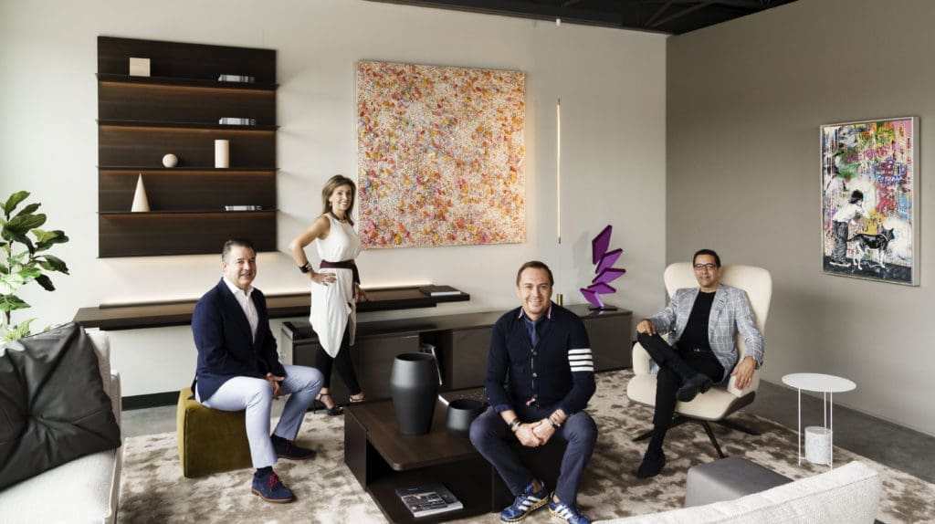 Art of the World Gallery's Mauricio Vallejo and Liliana Molina join forces with BeDesign's Adrian Dueñas and Marcelo Saenz to support Houston Grand Opera. They are photographed in the BeDesign studio with artwork from the gallery. (Photo by Jack Thompson)