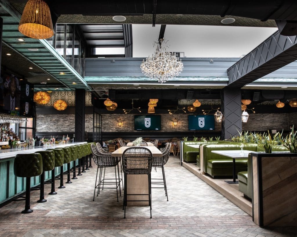 The sleek space of The Sporting Club, retractible roof open, was created by CBD Architects, based in Chicago. (Photo by Corine Michel )