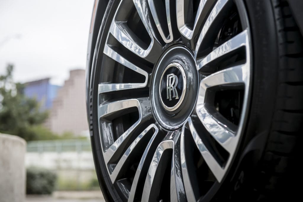 Is there any more sophisticated hubcap than that of the Rolls-Royce Ghost, which also features the monogram on all headrests in a buyer-selected color. (Photo by James Lipman for Rolls-Royce)