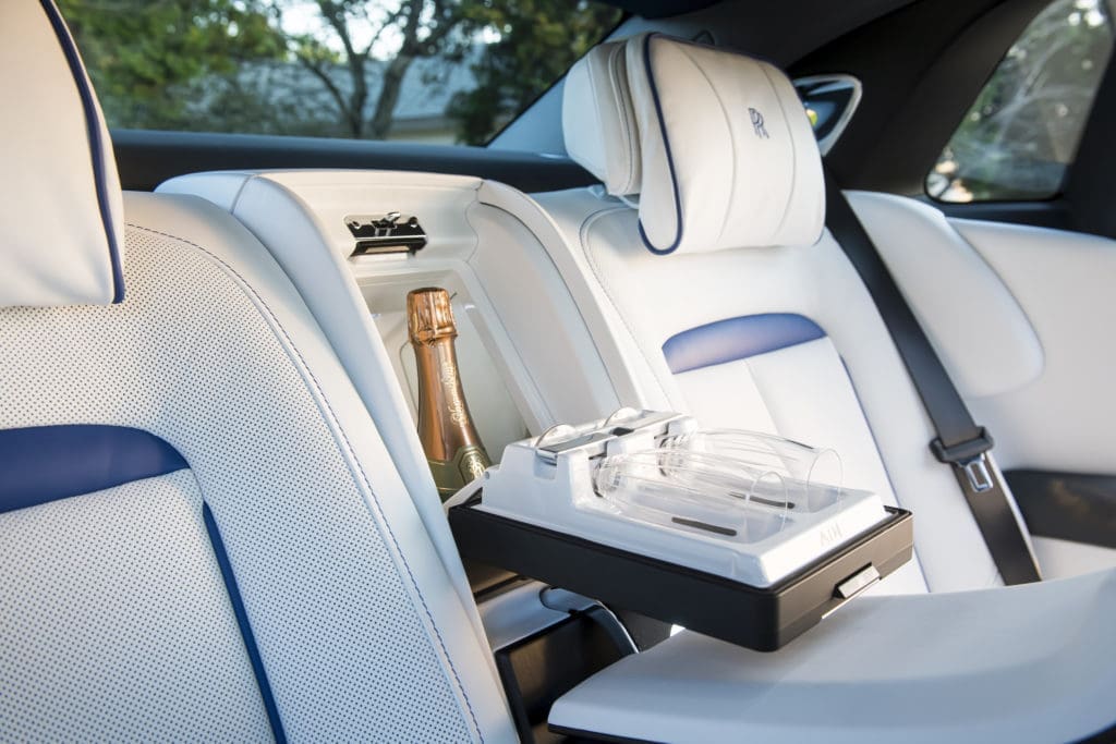 One option in the 2021 Rolls-Royce Ghost is the chilled compartment outfitted for a bottle of champagne or other adult beverage and glasses. (Photo by James Lipman for Rolls-Royce)