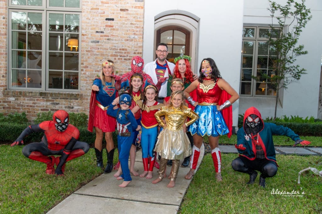 The Children's Museum Houston virtual gala brought together families across the city for a superhero evening, here the Molly and Matt LaFauci and Lexi and Aaron Boudreaux families celebrate.