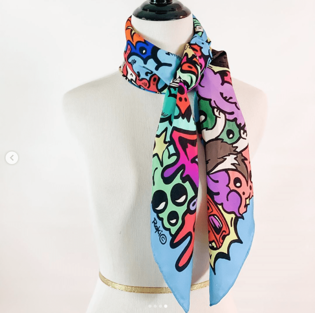 The versatility of the RoKi silk scarves is illustrated here. This 'D' scarf benefits the Boy Scouts of America.