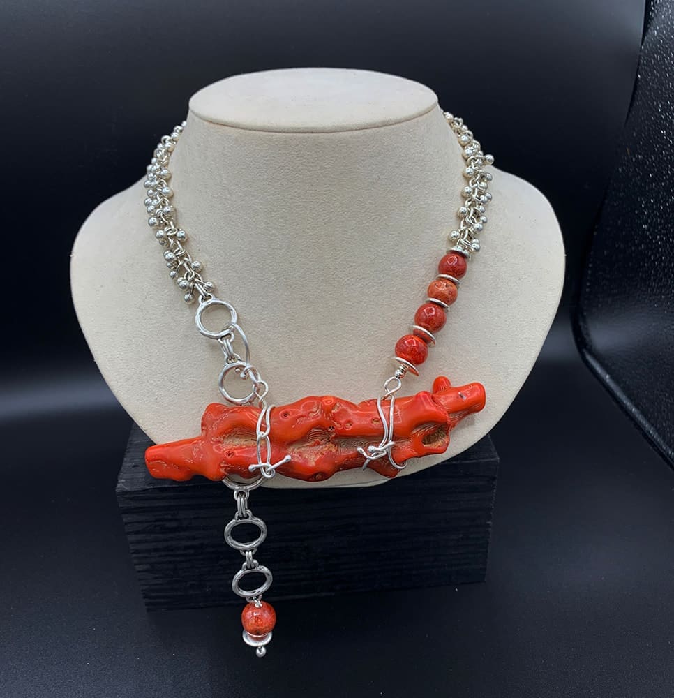 Some of the coral in her design is forty plus years old -  Big Coral Branch set with silver.