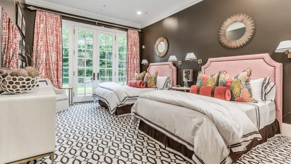 Yummy guest bedroom in soothing chocolate brown with coral accents.