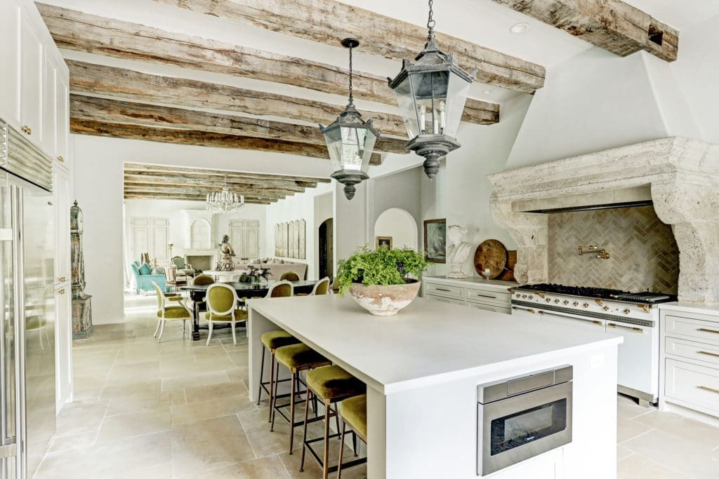 Antique beams stretch from the open kitchen to the family room at  722 E. Friar Tuck Lane.
