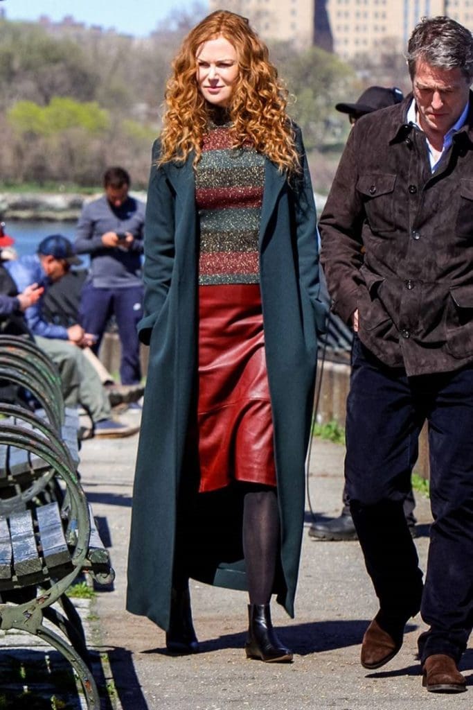 In a long blue coat, Nicole Kidman strolls with Hugh Grant in a scene from HBO's 'The Undoing.' (Image courtesy of HBO. )