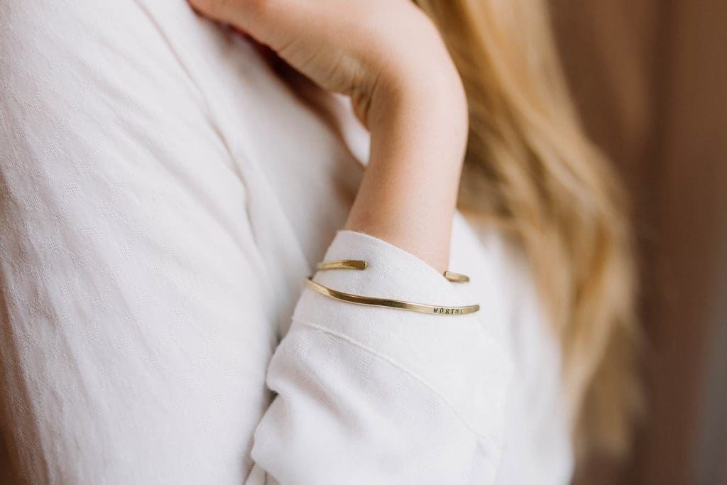 Worthy Co.'s brass cuff supports local women, and reminds you of their mission.