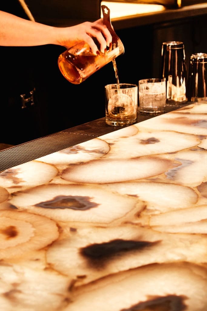 Drinks at a bar in The National building. (Photo by Gustav Schmiege)