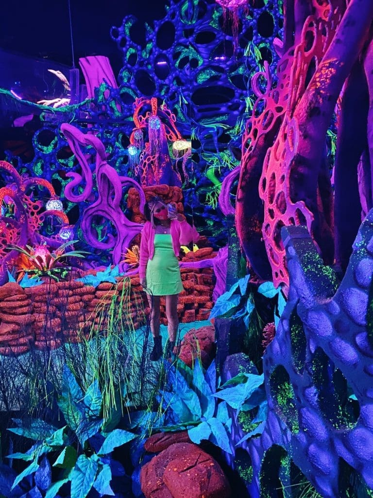 The "Avatar"-inspired exhibit "Eden" is the perfect place for your next Instagram post: The blacklight reactive paint really makes the neon colors pop. (Photo by Madeline Coats)