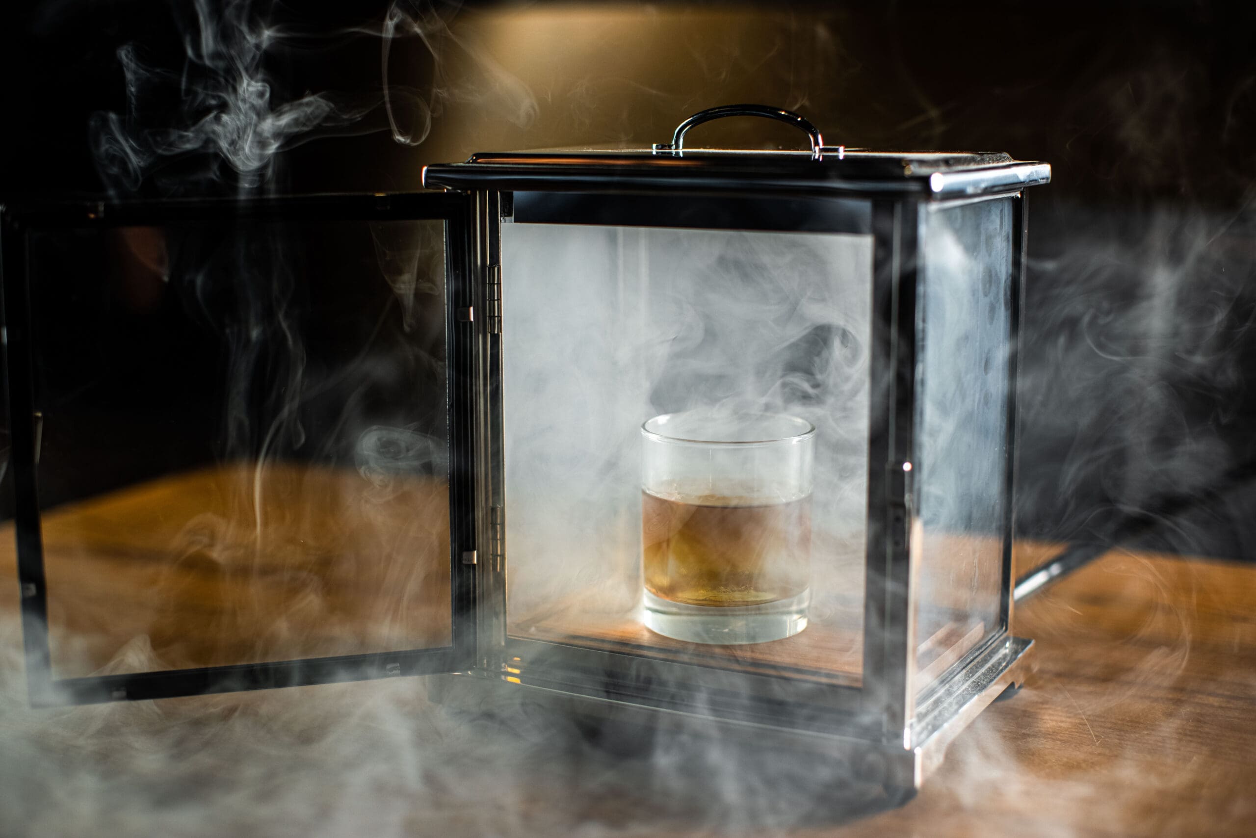 Signature drinks at Ounce include a Cigar Smoked Old Fashioned. (Photo by Kathy Tran)