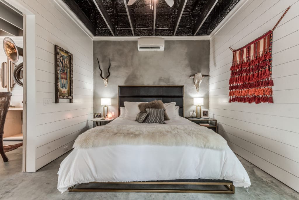 The kingsize bed fits nicely into the 851 sq. ft. bungalow by Steven Allen Designs.