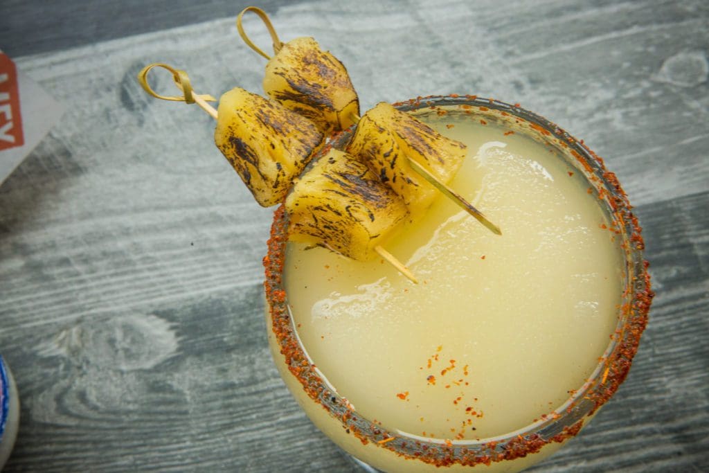 The frozen Moscow margarita, infused with lime and tequila and garnished with charred chunks of pineapple, is a customer favorite. 