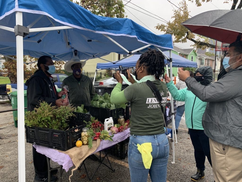 Local vendors sell fresh fruits and vegetables at Freedmen's Town Farmers Market. (Photo by Priscilla T. Graham). 