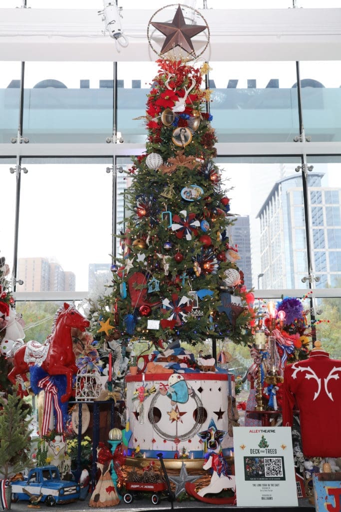 The Alley Theatre Deck the Trees display of decorated conifers. The Lone Star in the East tree by Barry Doss Design.