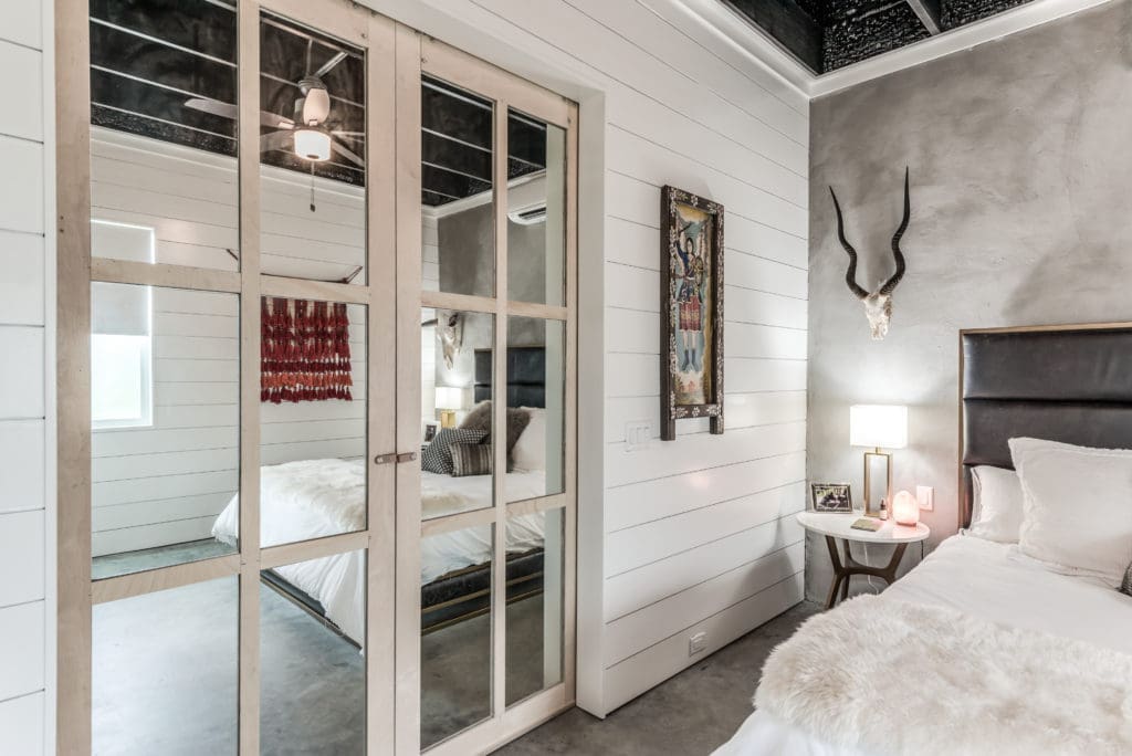 The kingsize bed fits nicely into the 851 sq. ft. bungalow by Steven Allen Designs.