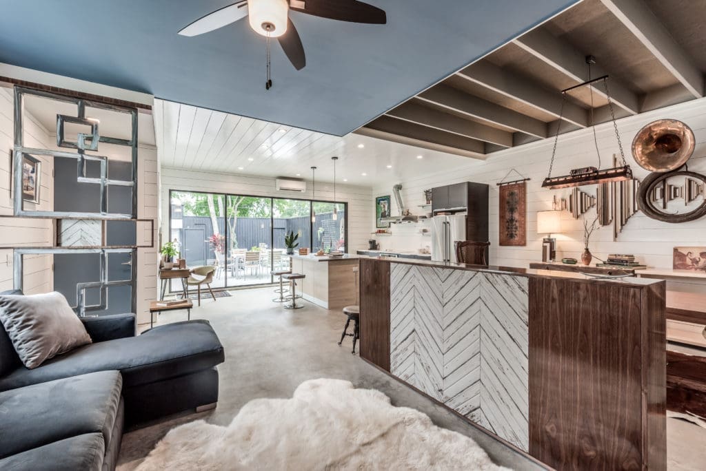 Steven Allen Designs' Nouveau Bungalow employs three different ceiling treatments to define the spaces in the open floor plan.