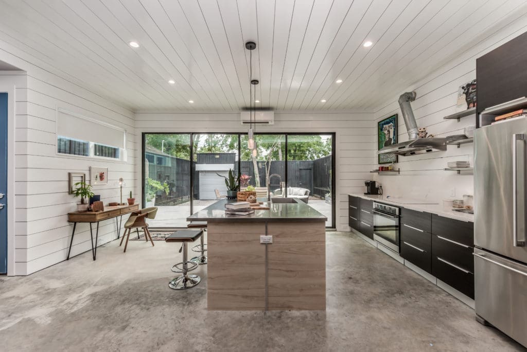 Glass sliding doors open wide to expand the livable space to the spacious outdoor deck.