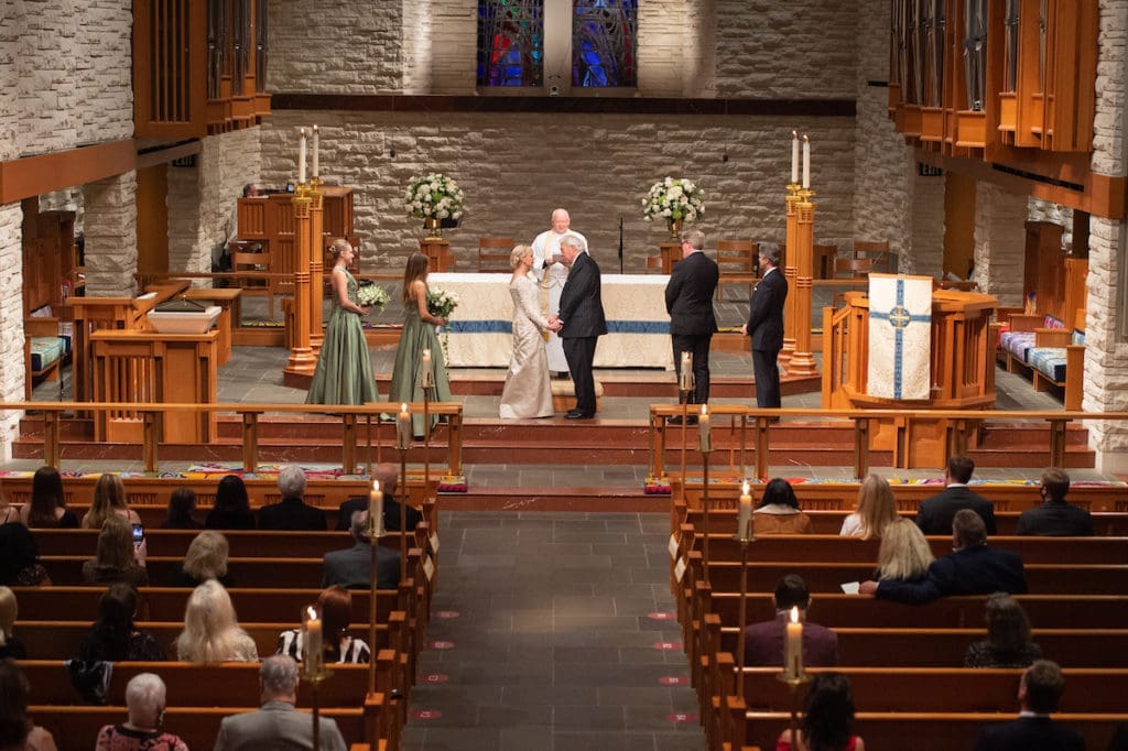 Karen Ann Bradshaw and Jack Morris Rains exchange vows at The Church of St. John the Divine where the Rev. Reagan Cocke officiated. (Photo by Wilson Parish)