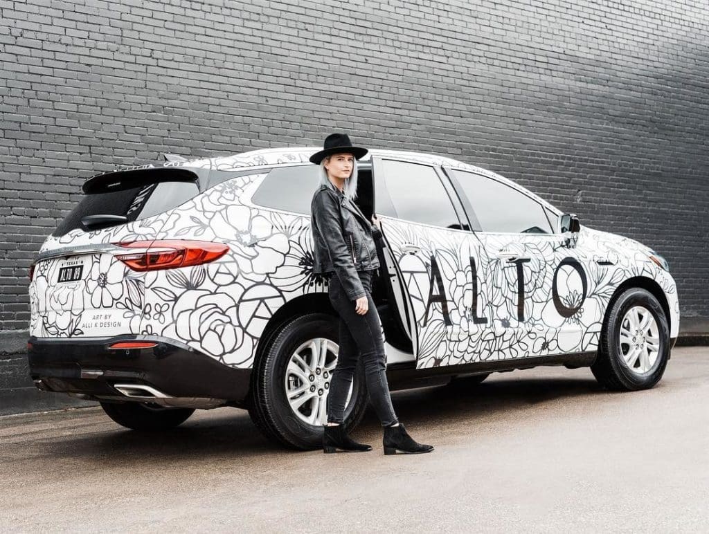 Alli K with the Art Car that she created for Alto in Dallas — the art car is a tradition of transforming the Buick Enclaves. (Courtesy of Alli K Design)