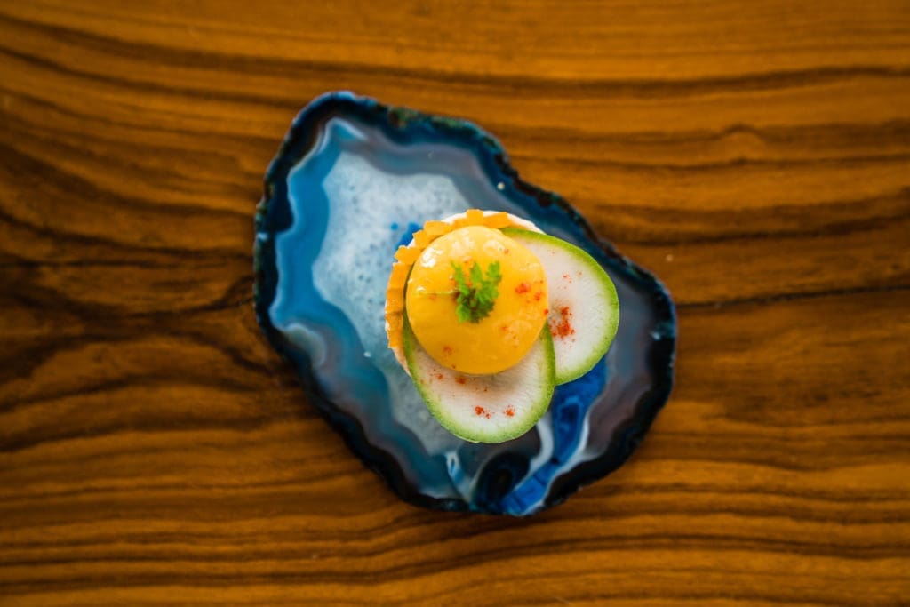 Aamsutra comes with a mango coconut sphere and is on Musaafer's menu. (Photo by Raydon Creative)