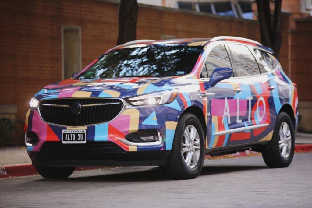Dallas artist Mariel Pohlman creates a colorful art car for Alto, the Dallas-based ride-hailing/delivery service business.