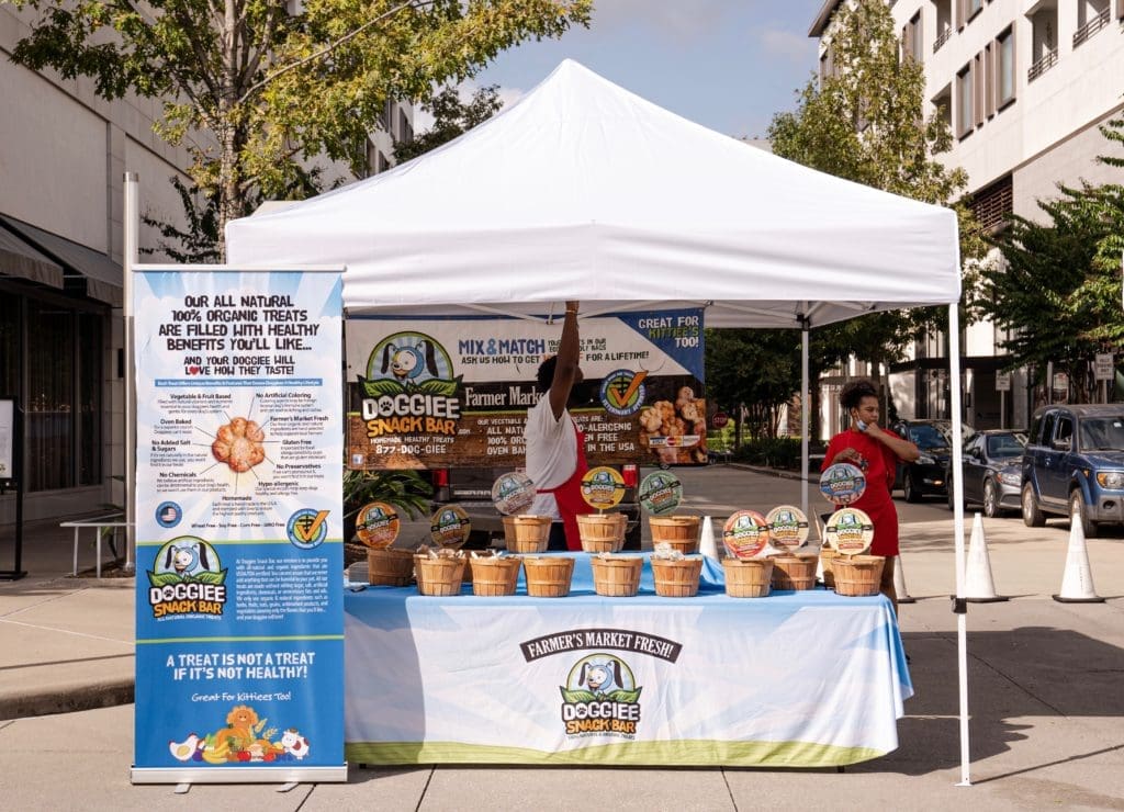The once-monthly upscale farmers market at River Oaks District caters to pets and pet owners including vendors selling gourmet pet food such as Doggiee Snack Bar. (Photo by Michael Anthony)