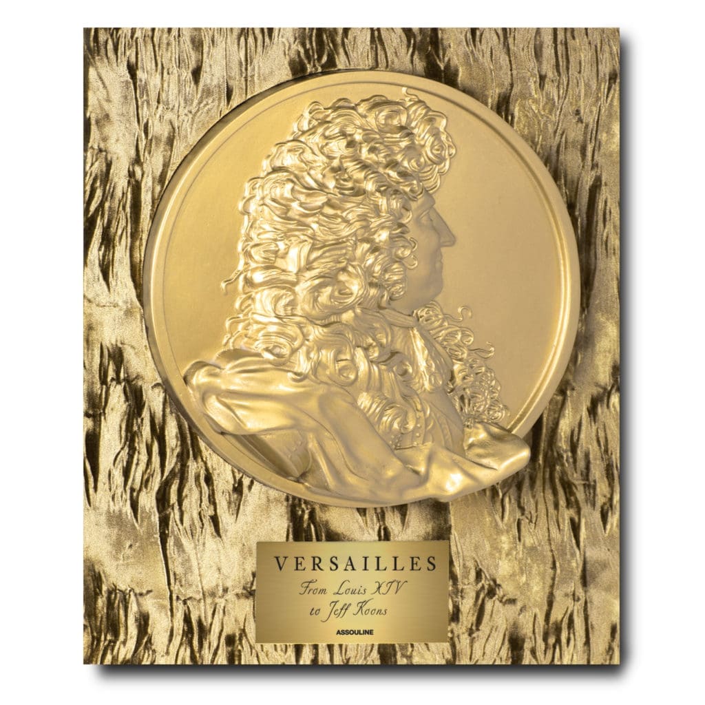 A gold sculpted medallion of Louis IV decorates the case of Versailles: From Louis XIV to Jeff Koons Special Edition (Photo by Assouline)
