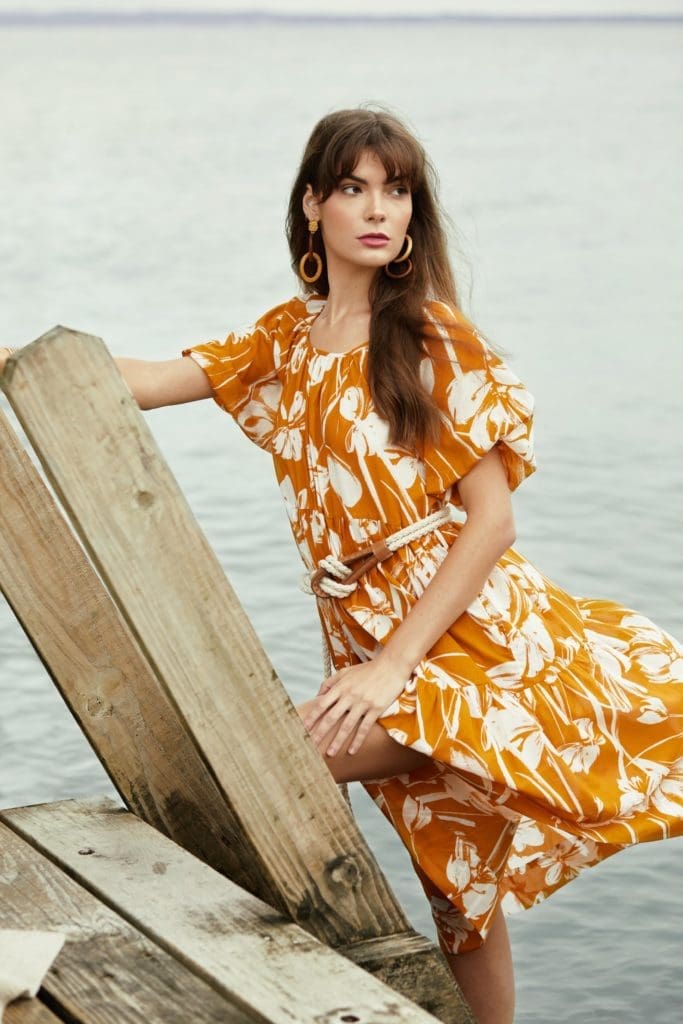 Christy Lynn's Audrey midi-dress in the Soleil fabric features a short puffed sleeve with a three-tier skirt.